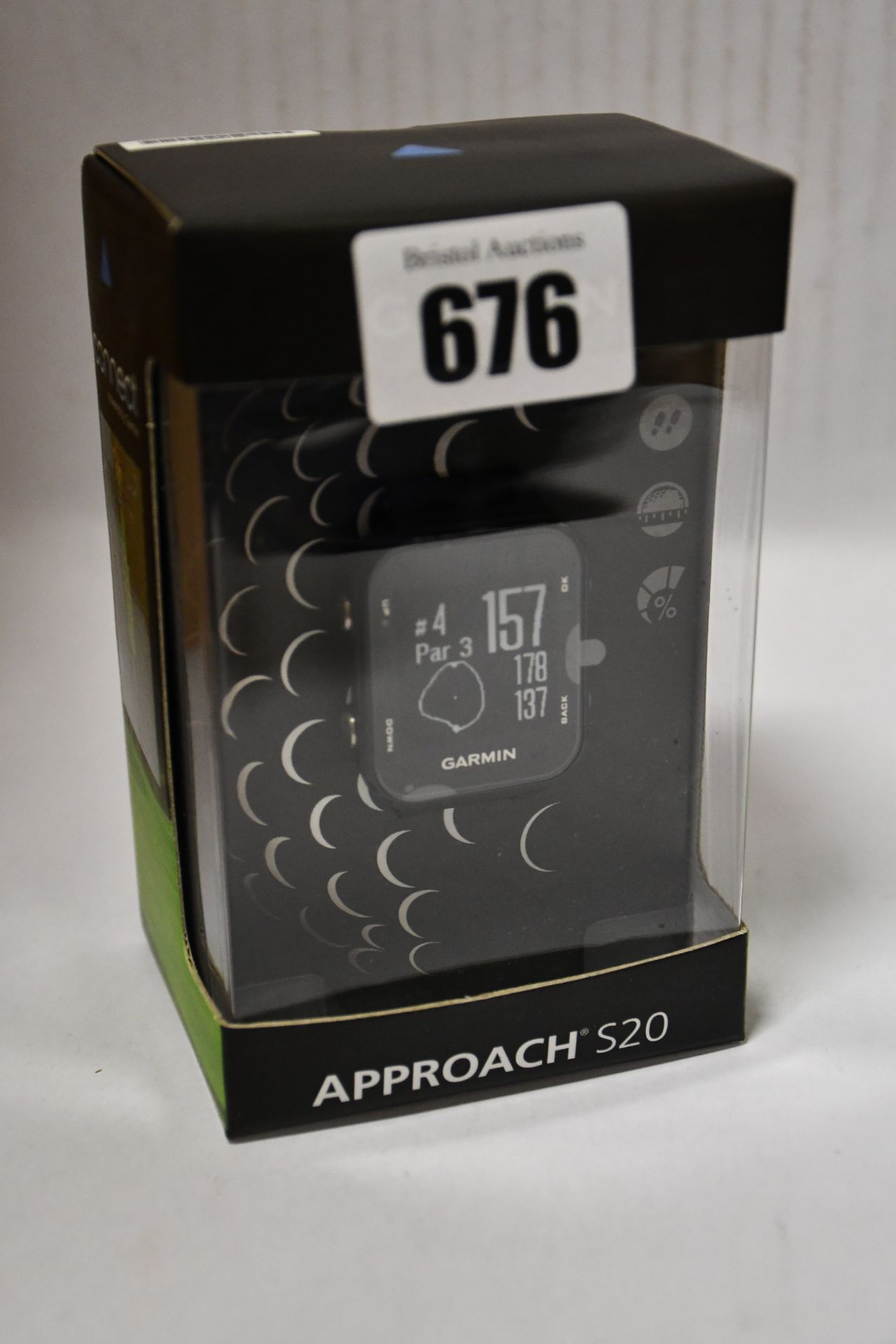 One man's boxed as new Garmin Approach S20 GPS golf watch with step tracking in black.