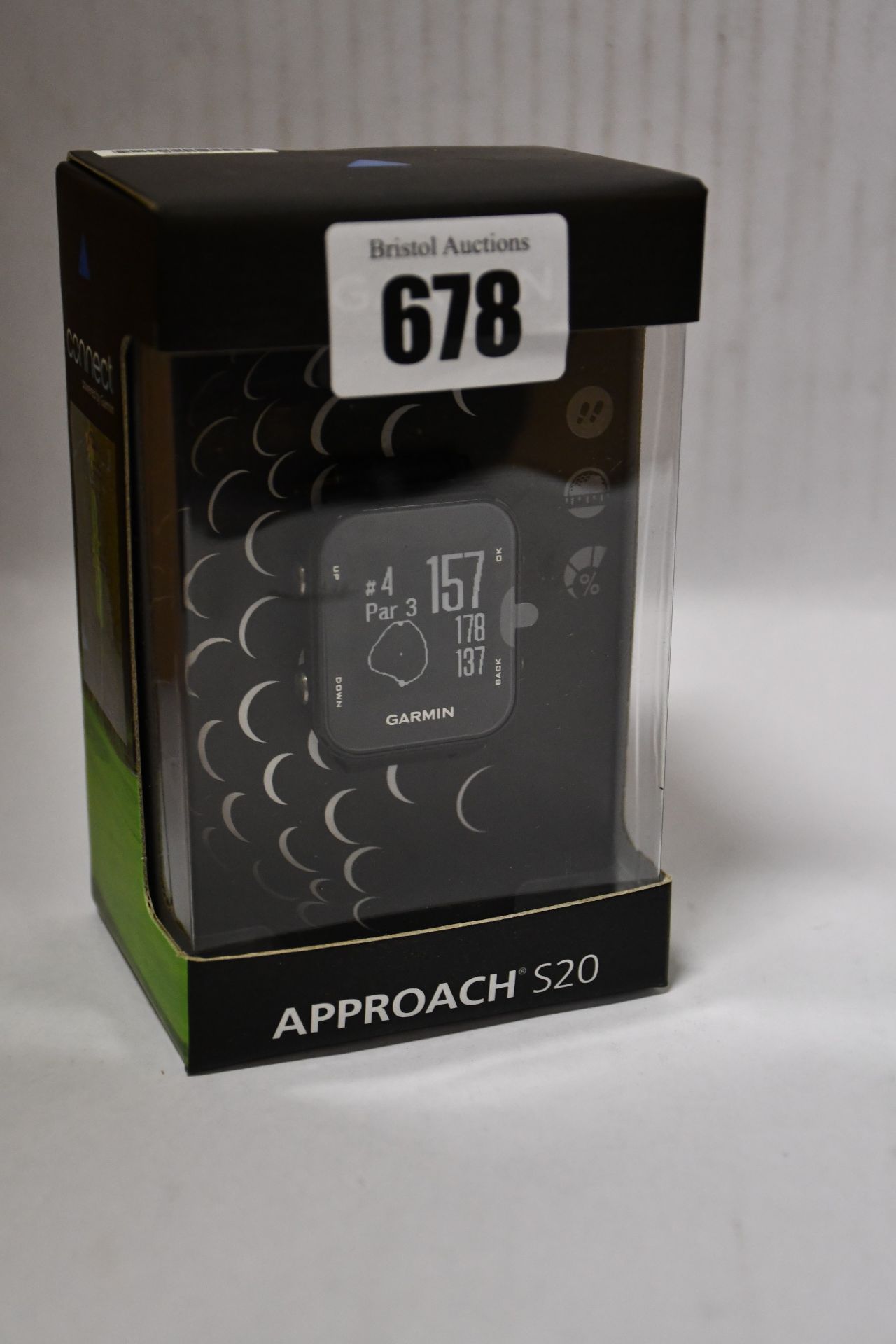 One man's boxed as new Garmin Approach S20 GPS golf watch with step tracking in black.