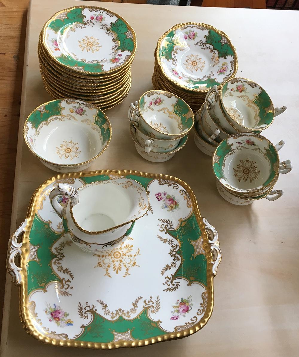 A Coalport tea service to include teacups (12), saucers (12), small plates (12), two cake plates,