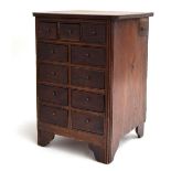 A mahogany specimen chest, three short drawers over four pairs of two drawers, with pen slide to