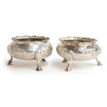 A matched pair of Victorian silver salts in George II style, of circular form with gadrooned edge