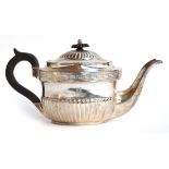 A George III silver teapot, by John Emes, London 1802, of oval form, the body half fluted with Greek