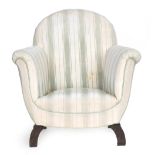 A Regency style armchair with scrolling arm supports, upholstered in a striped fabric