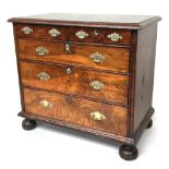 A magnificent walnut chest of two short drawers over three graduating long drawers, the drawers