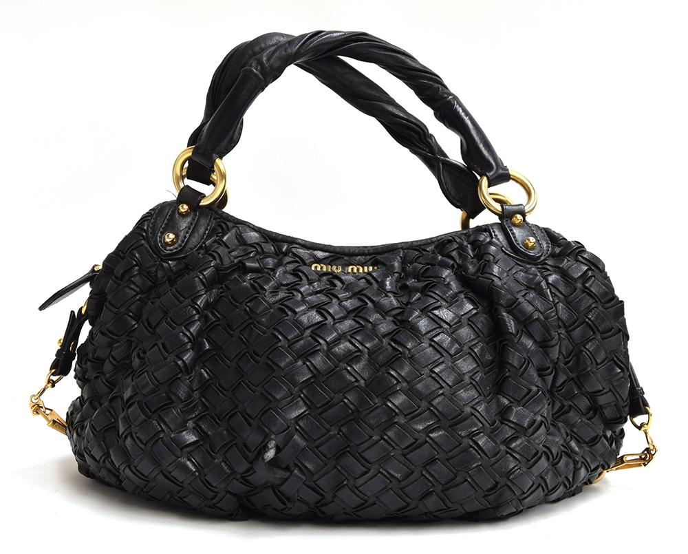 Black woven leather handbag from Mui Mui, twisted leather handles attached with heavy brass hoops,