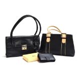 Two handbags from Tommy and Kate, one black with tan handles and silver coloured buckles (19x 33cm