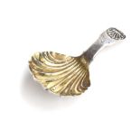 A George III silver tea caddy spoon with shell shaped bowl, the handle engraved with lion rampant