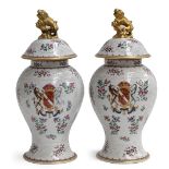 A pair of Samson famille rose and armorial baluster vases and covers, with gilt kylin knops, 40cmH