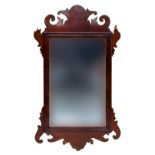 A Georgian fret carved mahogany veneered rectangular wall mirror, 58x32cm Provenance: from the