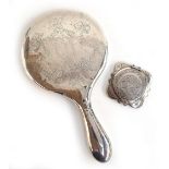 A silver looking glass, together with a Mexican silver compact mirror