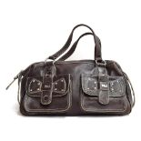 Brown leather handbag from Marc Jacobs, bowling bag shape, two outside pockets wtith studded leather