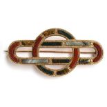 A Scottish brooch set with agates, 5.75cm, tests as 9ct