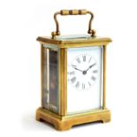 A FRENCH CARRIAGE CLOCK WITH KEY Case: WIDTH 8cm, HEIGHT 11cm, DEPTH 61/2 cm