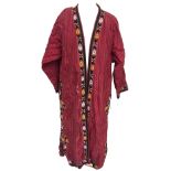 Two silk Tekke Turkman coats, early 20th century, both of hand woven red striped silk, one with