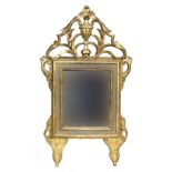 An Italian directoire giltwood wall mirror, the rectangular plate within mirrored border, surmounted