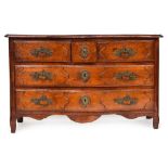 An 18th century French provincial walnut and fruitwood serpentine chest, with two short drawers