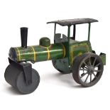 An early tinplate clockwork steamroller, made in Germany, green/black with red/yellow trim, marked