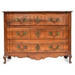 A French 'provincial' walnut serpentine fronted chest, probably 18th century, of three long panelled