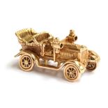 A 9ct gold car bracelet charm in the form of a vintage car, gross weight 11.2g