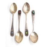 A set of four Scottish silver coffee spoons, by Norah Creswick, Edinburgh 1950, the scrolling