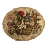 A late Georgian oval applied collage of felt flowers in a basket, in contemporary frame (silk worn),