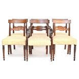 A set of six Regency style dining chairs, two carvers, the curved rail with reeded supports,