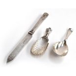 A silver shell caddy spoon with mask terminal, import marked, together with a crested Hanoverian