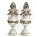 A pair of 20th Century porcelain vases, each with flower-encrusted cover, the fluted urn-shaped