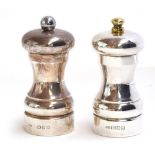 A pair of capstan mills of standard form, one pepper, one salt, by John Bull Ltd., London 1992 and