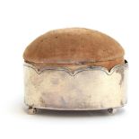An oval silver pin cushion on ball feet, London 1900, 7.7cm long Provenance: from the estate of