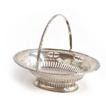 A swing handled strapwork pierced oval sweetmeat basket, inscribed, by William Henry Leather,