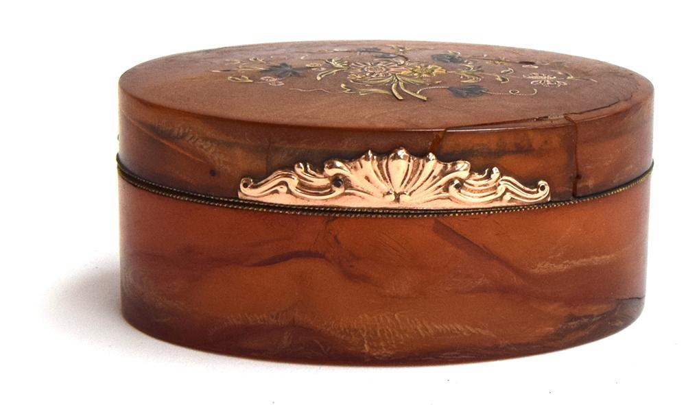 An 18th century blonde tortoiseshell oval box, the hinged cover with coloured gold piqué spray of