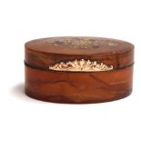 An 18th century blonde tortoiseshell oval box, the hinged cover with coloured gold piqué spray of