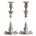 A pair of George III silver candlesticks, by John Scofield, London 1796, the separate bobèches