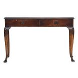 A George I style rectangular walnut side table, fitted with two frieze drawers on lappet carved