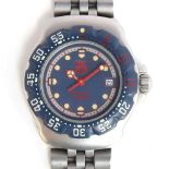 A LADIES STAINLESS STEEL TAG HEUER F1 QUARTZ WIRST WATCH CIRCA 1990s, BLUE, RED, AND WHITE DIAL,