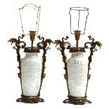 A pair of Chinese ormolu mounted crackle glaze vases, each with dragon handles, adapted as lamps,