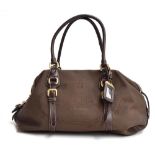 Prada handbag in brown logo jacquard with leather handles and trim and brass zip and buckles,