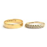A gold ring (marks indistinct) with 9 heart shaped settings inlaid with small diamonds, size N and