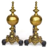 A pair of bulbous brass fire dogs in the Neo-classical style, 55cmH Provenance: from the estate of