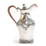 A silver coffee pot, mark's rubbed, Londond 1924, with a rose finial to the dome centred cover,