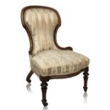 A 19th century salon chair, upholstered back and serpentine seat, reeded front legs and splayed back