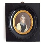 B.V. Portrait miniature of a lady, half-length, with auburn hair and lace bonnet, ruffle lace