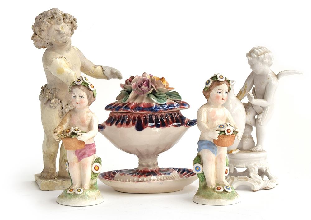 A group of ceramic figures to include a putto with crown impressed to base, 14cmH; another decorated