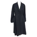 Fine black wool 1950s princess coat with black silk lining, in very good condition (size 10-12