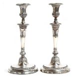 A pair of George III silver candlesticks, by John Scofield, London 1796, the separate bobeches