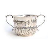 A silver twin handled cup, half gadrooned body with ropework decoration, by C J Vander, London 1921,