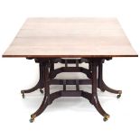 A Regency mahogany Cumberland action dining table, in two sections, the rectangular top with boxwood
