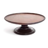 A Victorian mahogany lazy susan, the tray top on a spreading circular foot, 40.5cmD