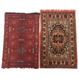 Two wool pile Dutch table rugs in red toned Turkish patterns (130 x 82cm approx)